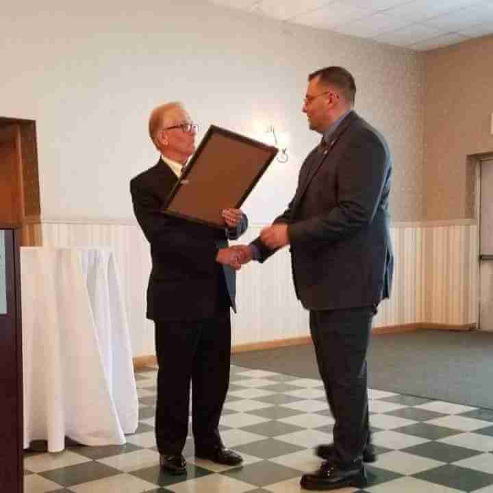 Michael Cataldi, right, accepts the Masonic Rookie Award from the Grand Lodge of Freemasons of Maine 2018.