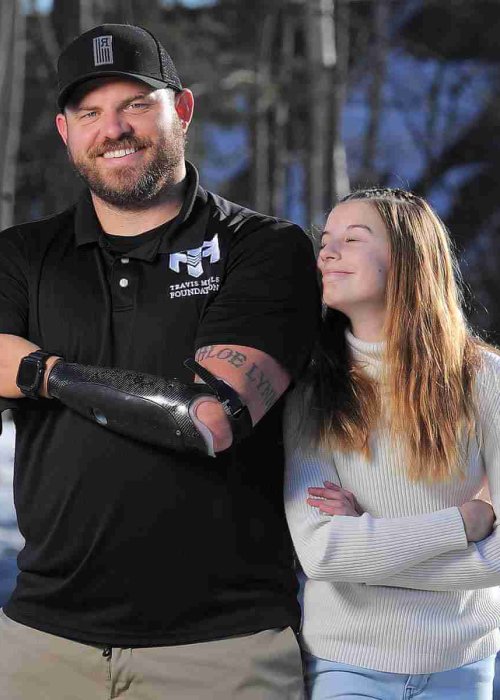 Travis Mills founder of the Travis Mills foundation based in Rome, ME.
With him is his daughter Chloe. They were in East Winthrop, ME.
 20230307.12
C. Fred J. Field
fredfield.com
207-233-3030